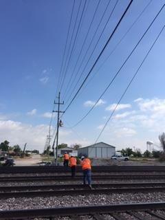 ALLO crew working across train tracks